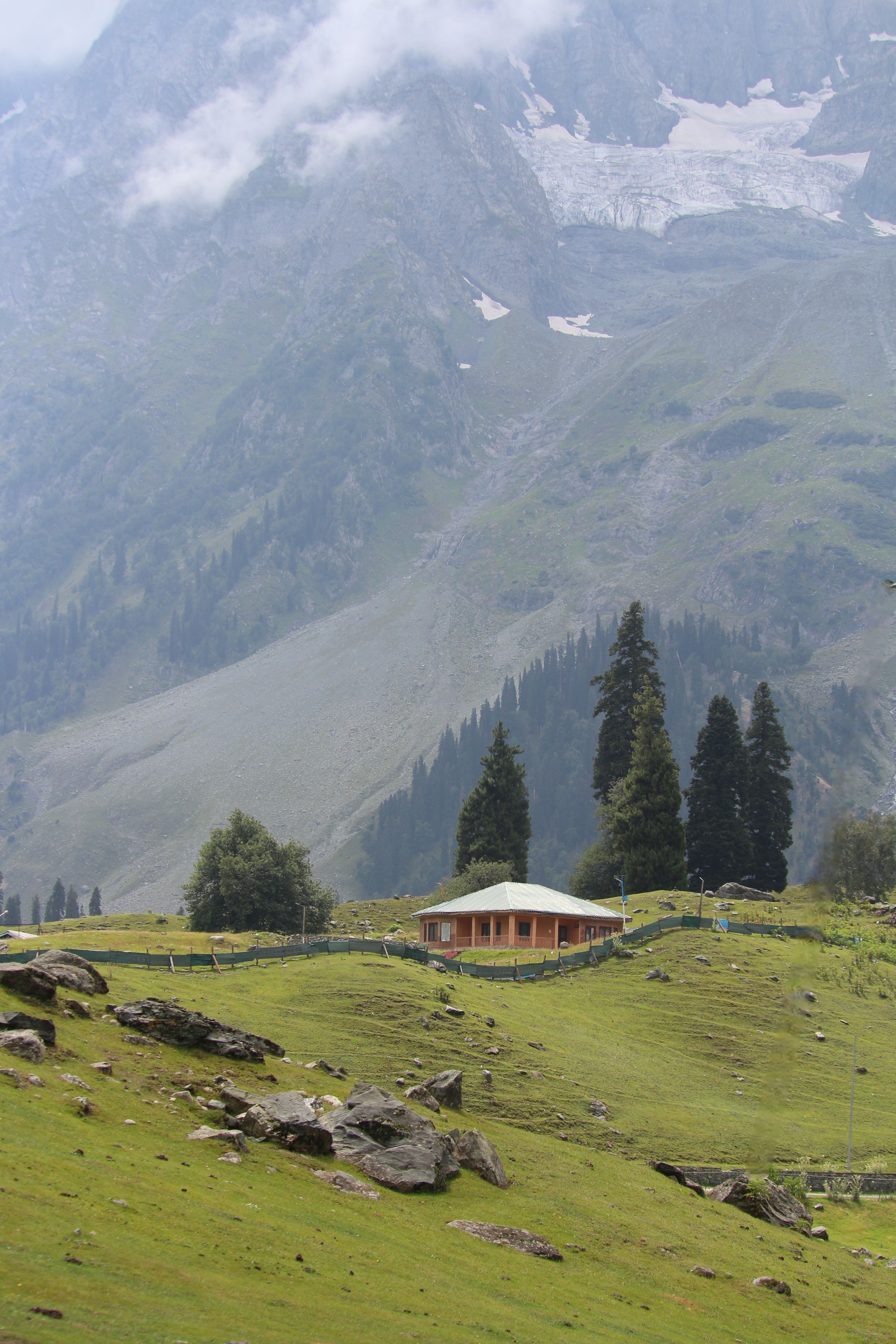 Scenic Mountain Valley with a Cozy Cabin · Free Stock Photo