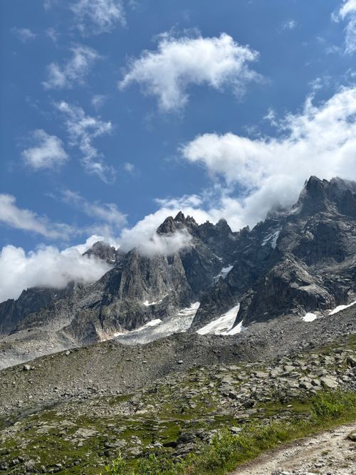 Free Stunning mountain peaks touching a partly cloudy sky, captured in broad daylight. Stock Photo
