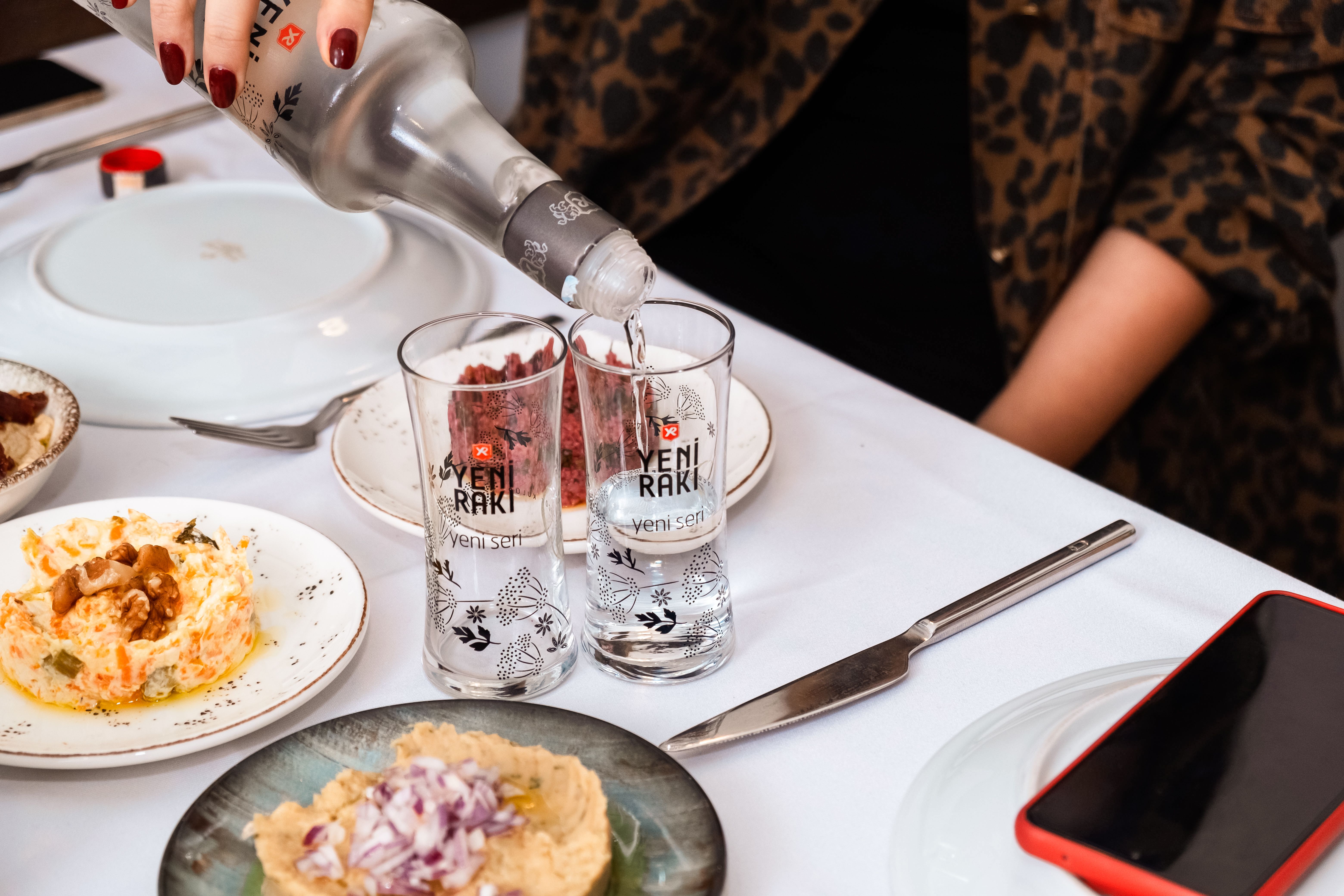 Pouring Yeni Rakı in Traditional Turkish Setting · Free Stock Photo