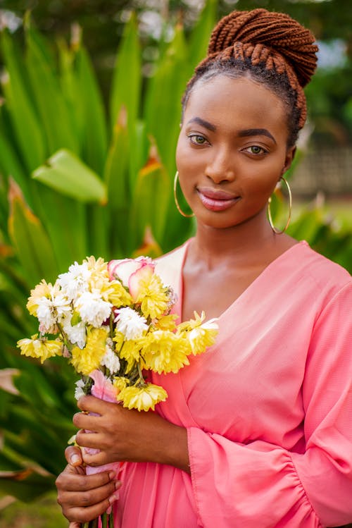 Woman Holding Bouquet of Flowers