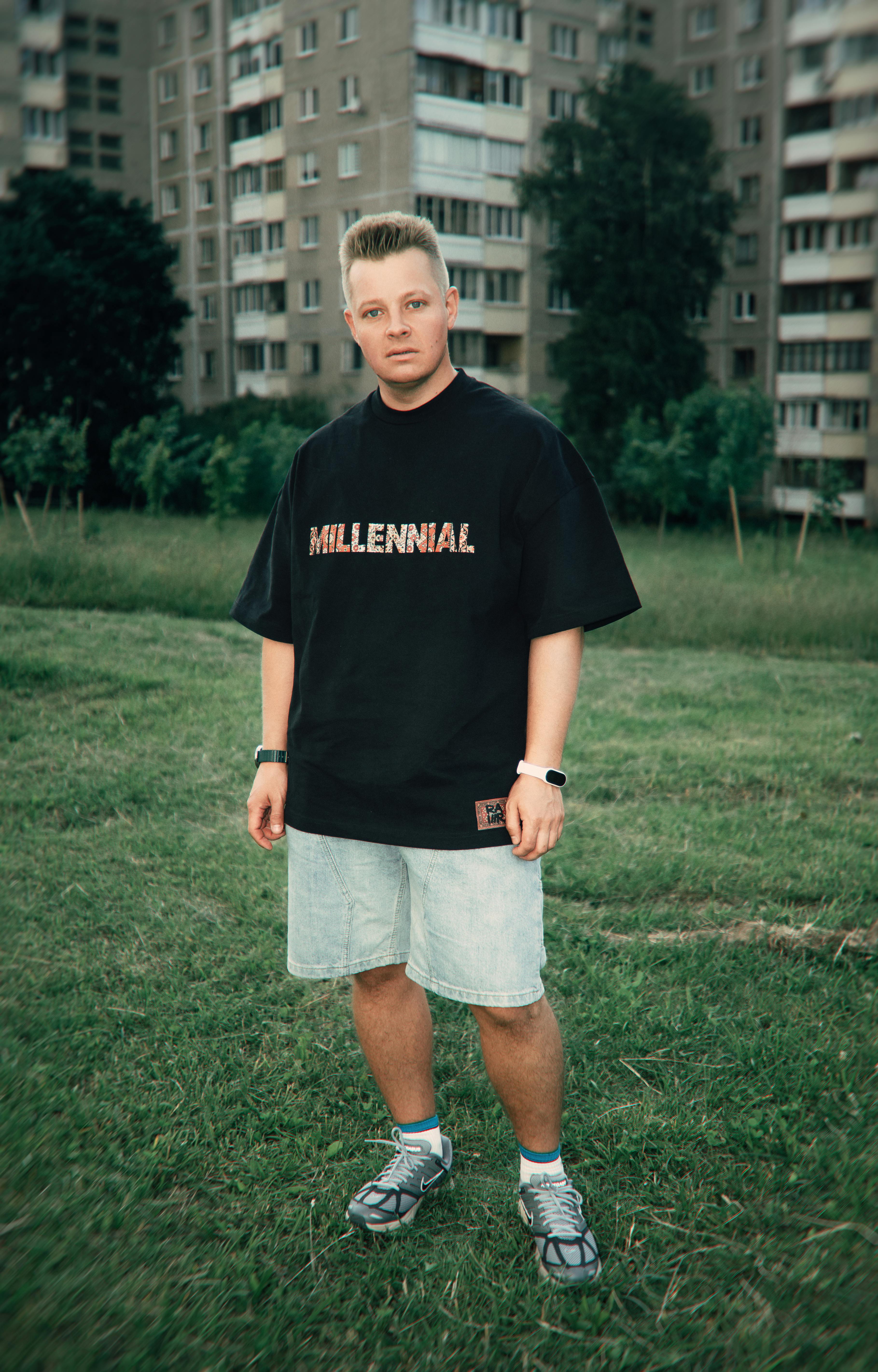 Young adult in casual millennial streetwear in a Minsk urban area, Belarus.