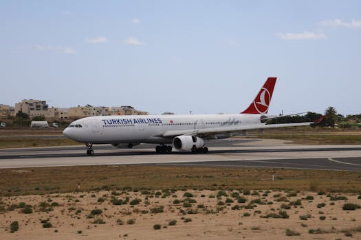 Turkish Airlines Airbus A330 taxiing on a runway in daylight.