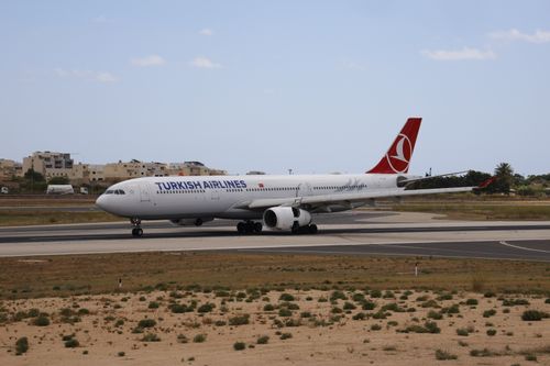 Free Turkish Airlines Airbus A330 taxiing on a runway in daylight. Stock Photo