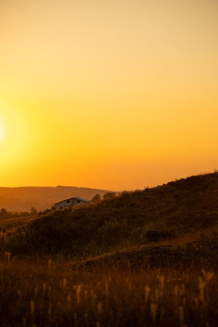 Captivating sunset view over Yalova hillside with warm golden hues and peaceful ambiance.