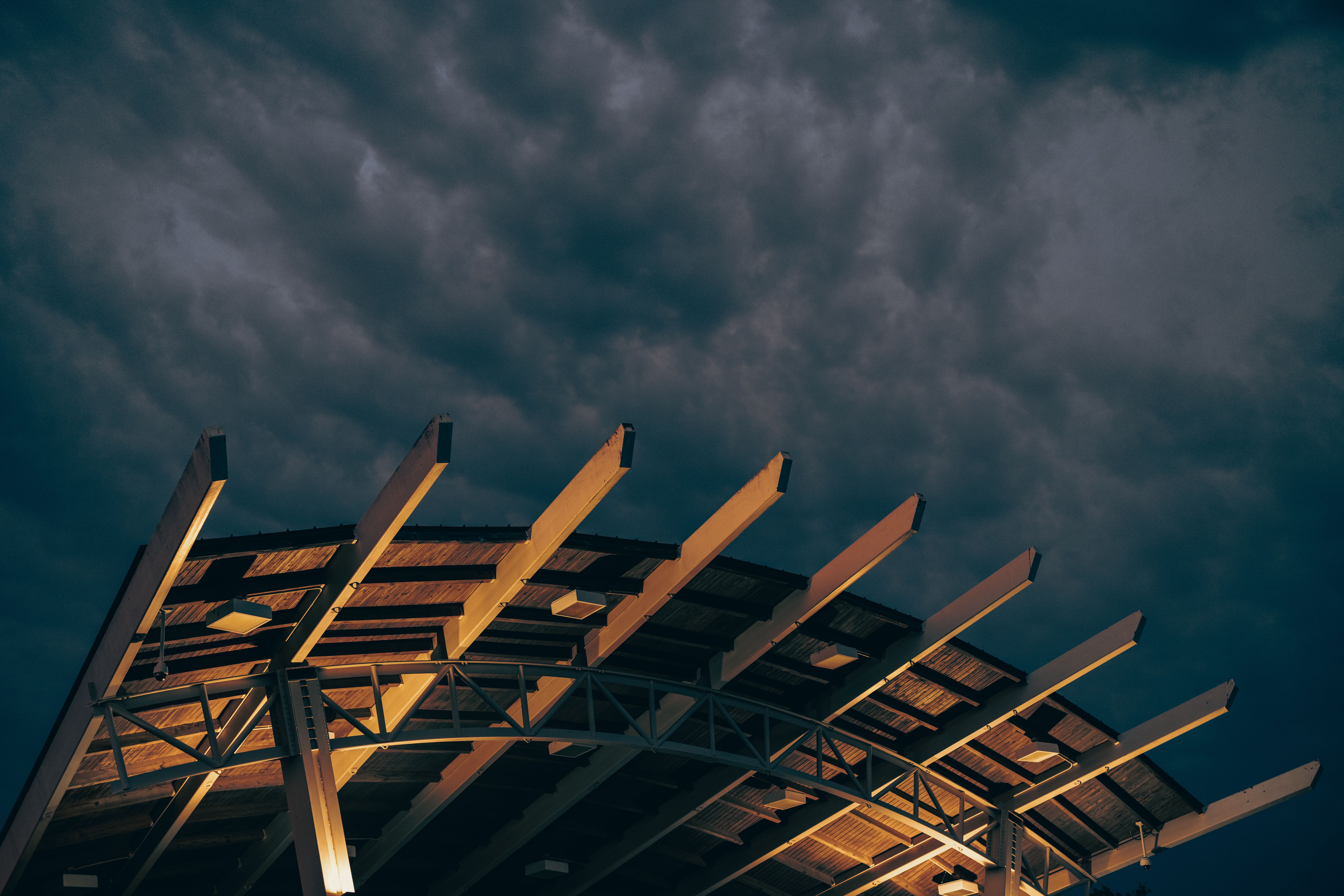 Modern architectural structure illuminated under a dramatic evening sky in Augusta, Georgia.
