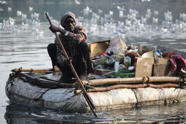 Man Sitting On Boat