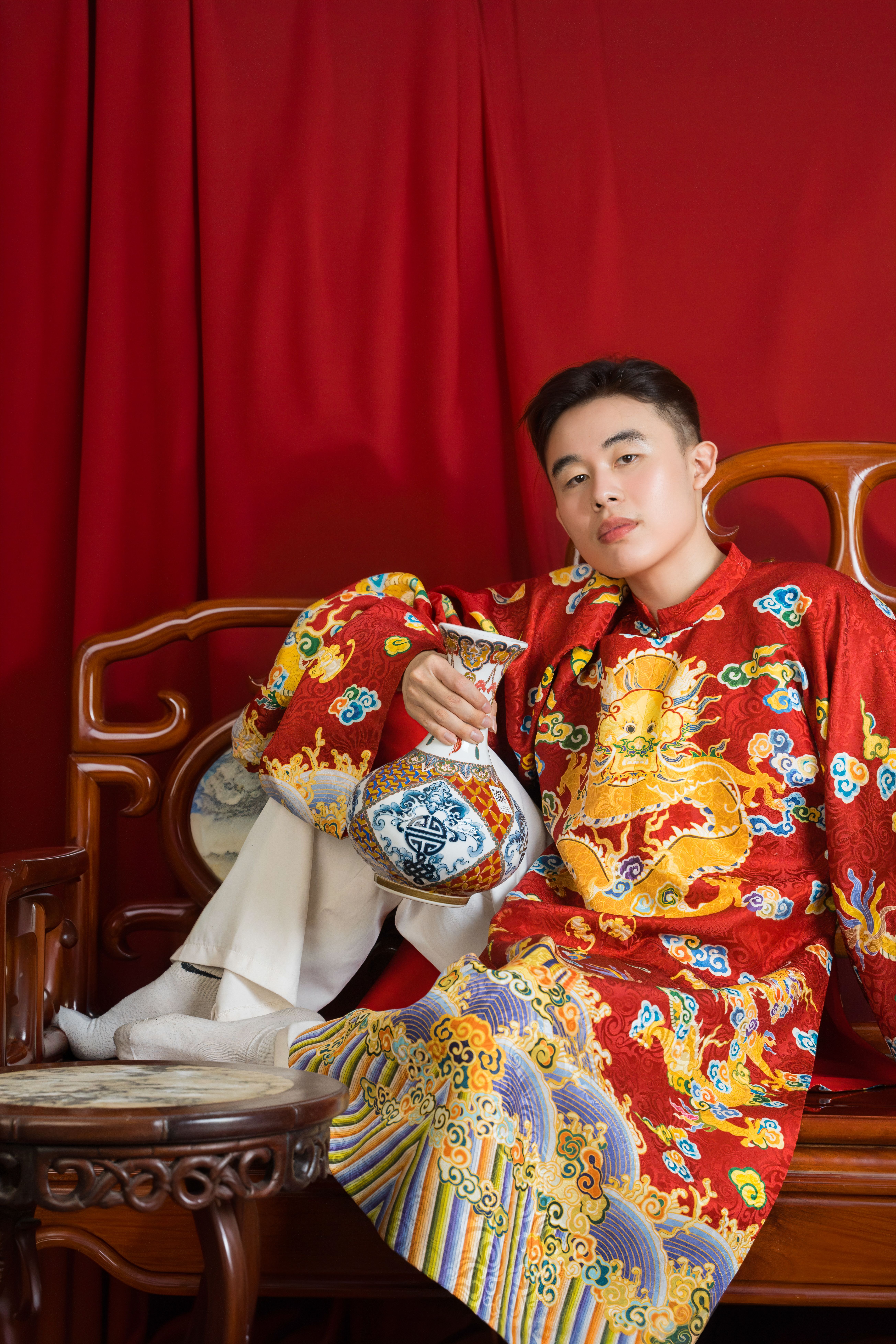 Elegant Asian Man in Traditional Red Attire · Free Stock Photo