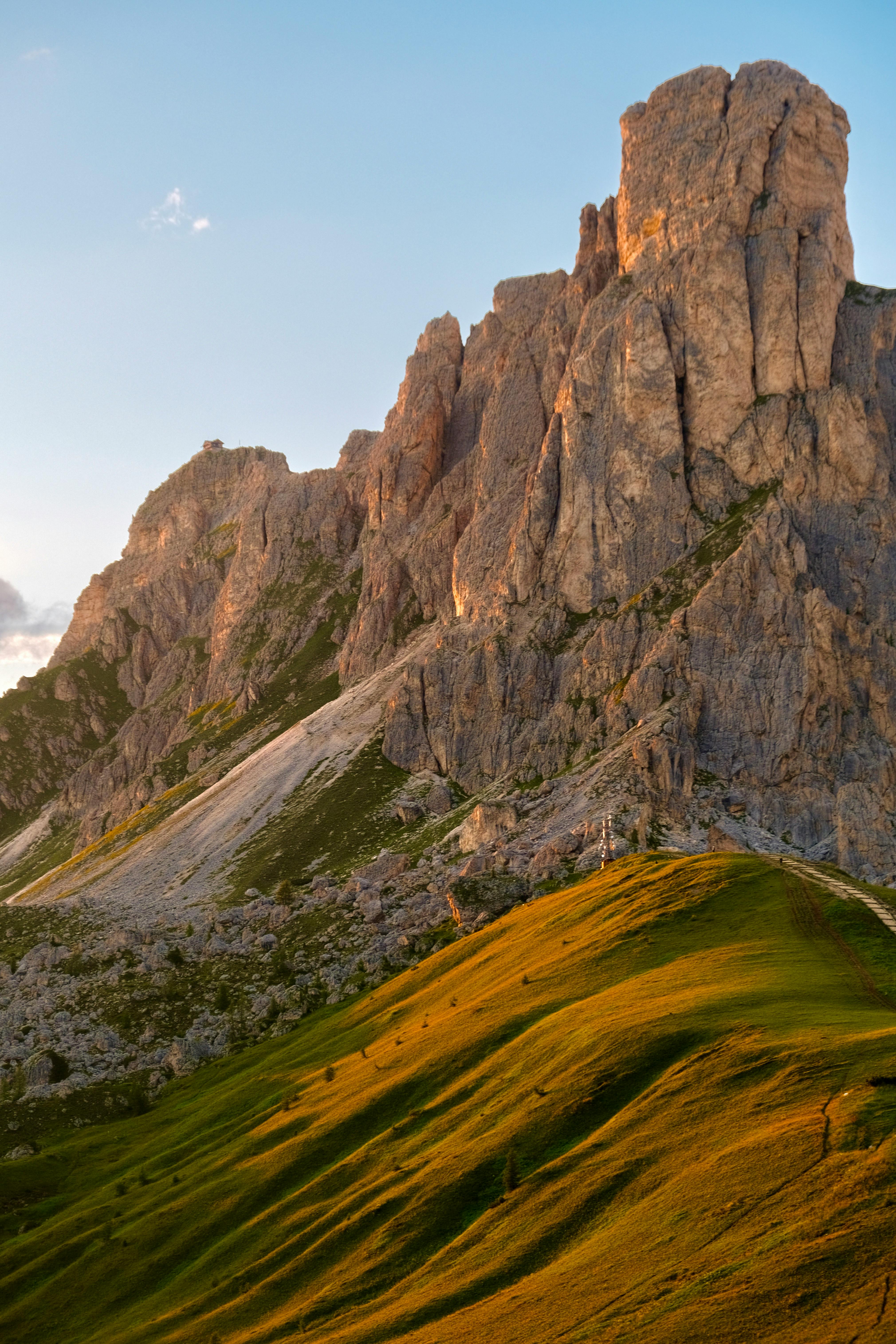 Captivating alpine landscape with dramatic rocky peaks and vibrant sunset colors.