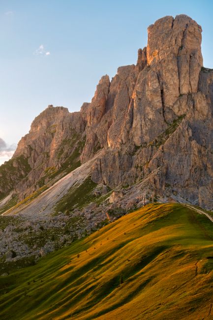 Captivating alpine landscape with dramatic rocky peaks and vibrant sunset colors.