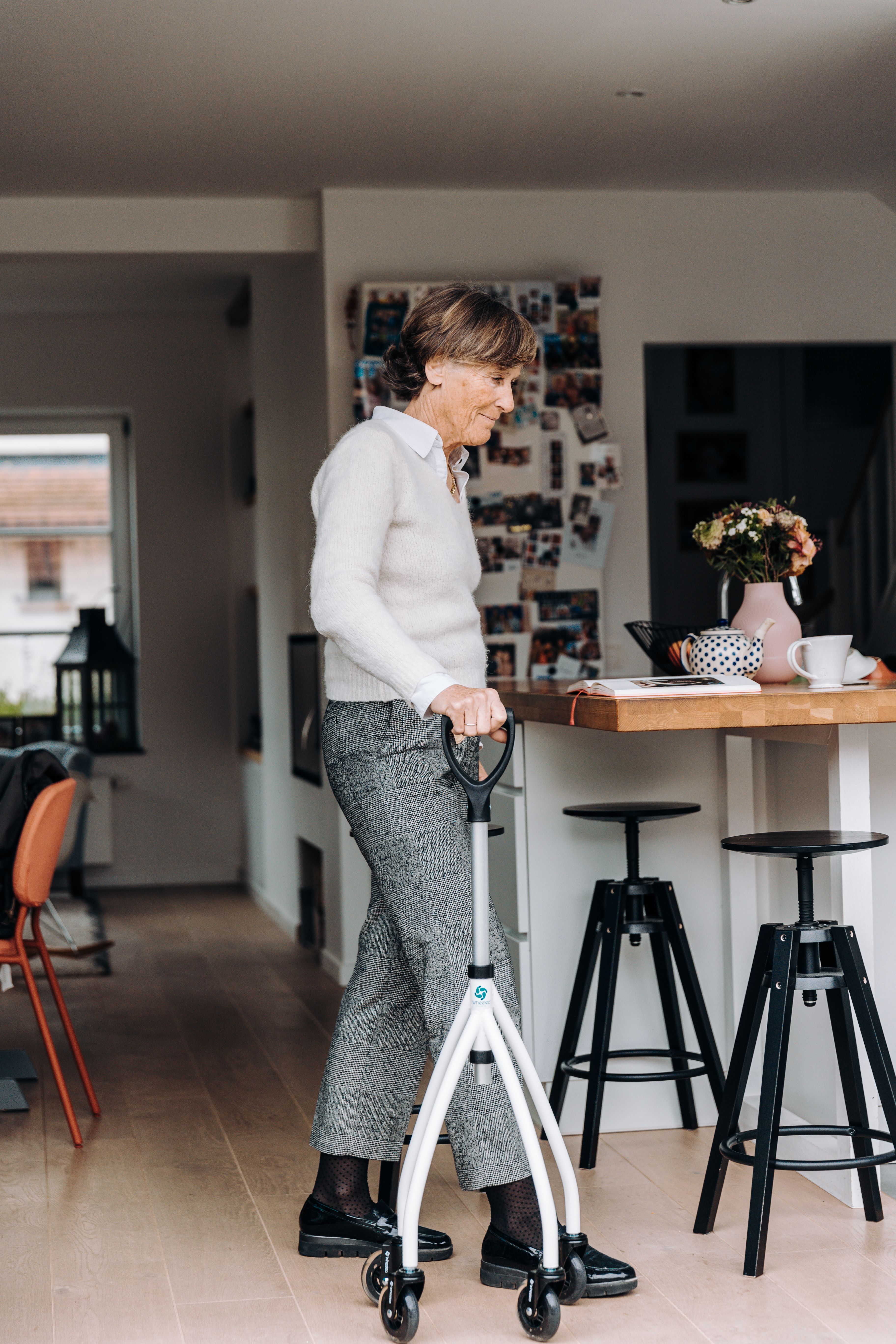 Senior Woman with Walker in Modern Home Interior · Free Stock Photo