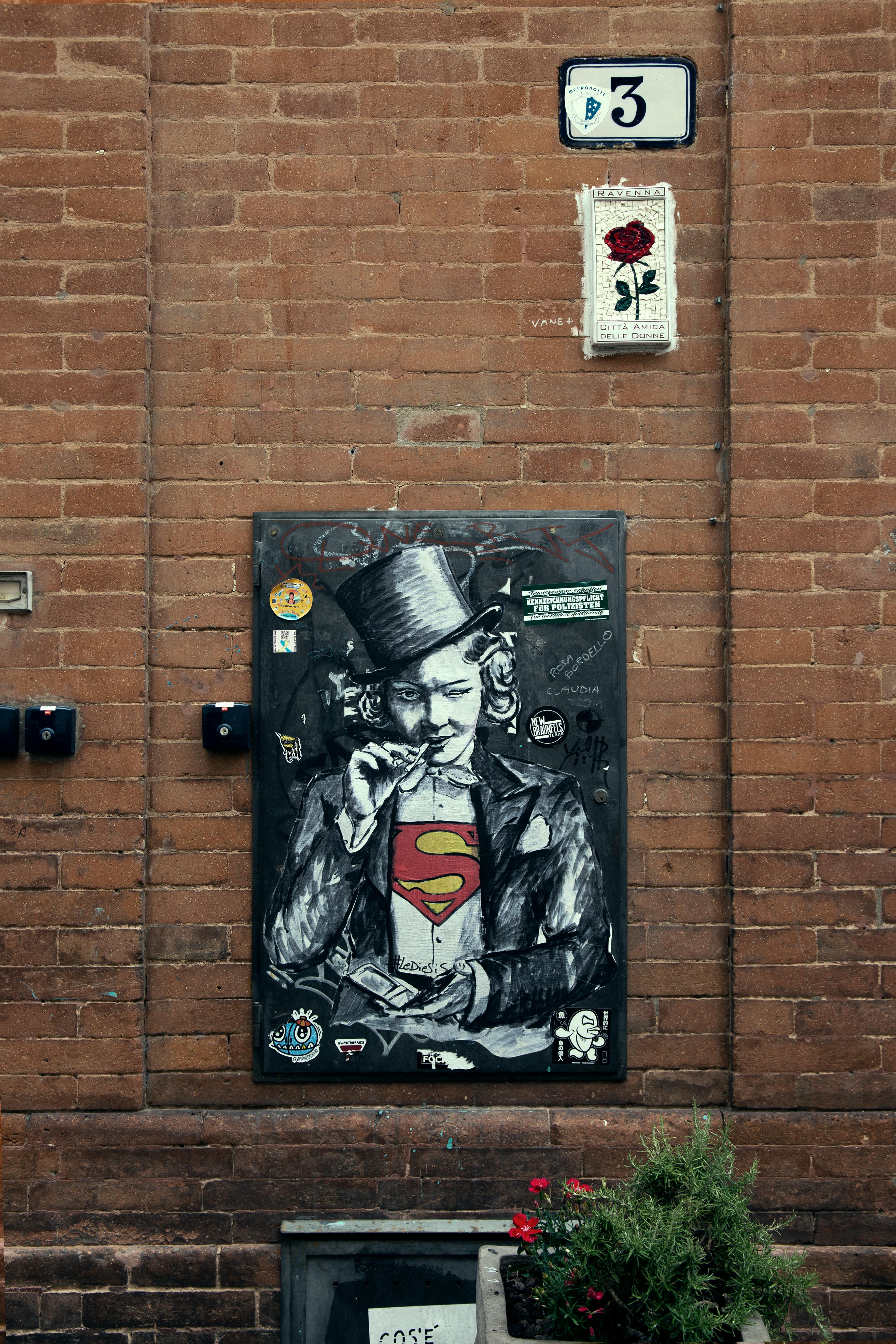 Captivating street art on a brick wall in Ravenna, showcasing creative urban expression.