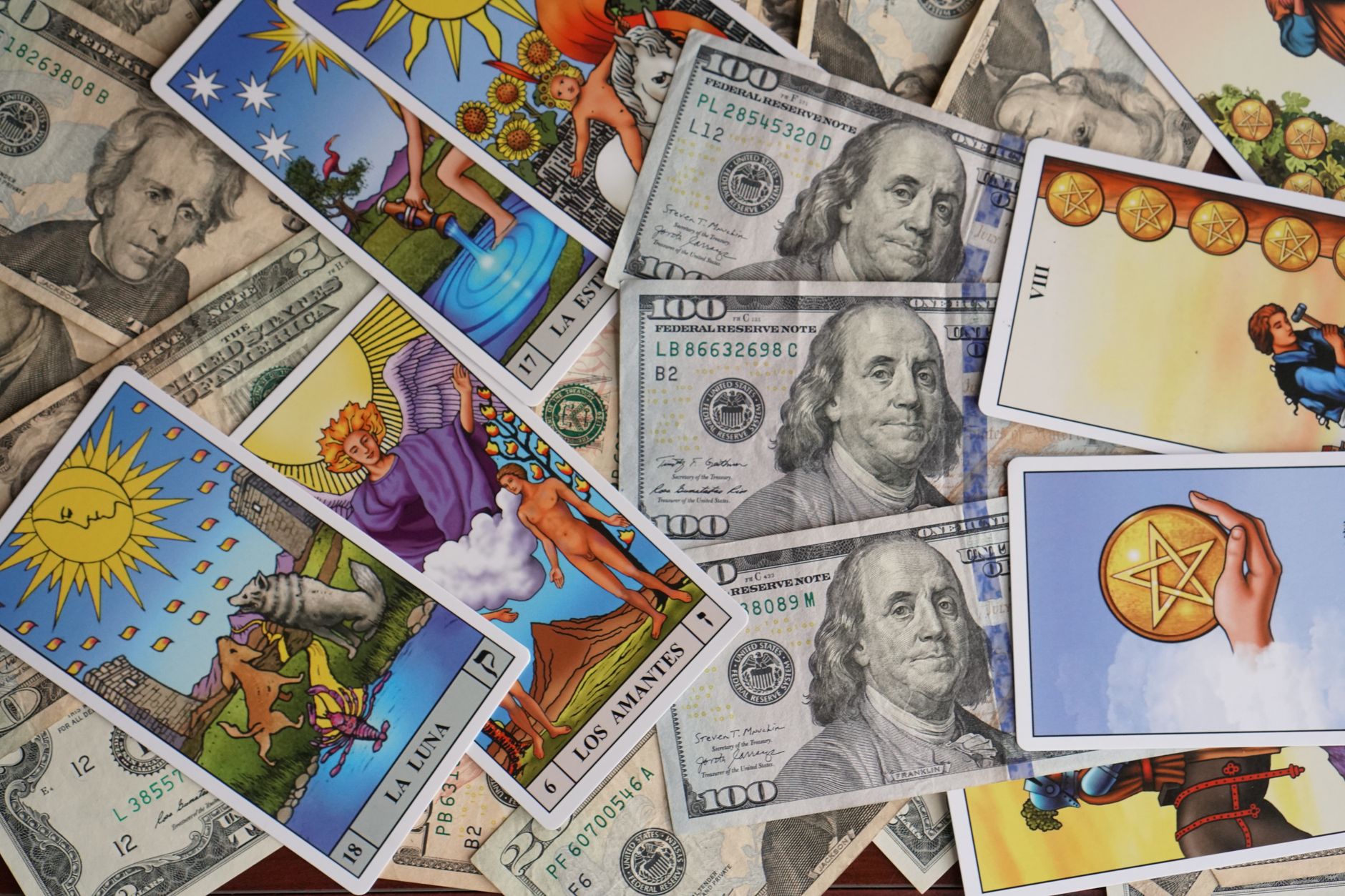 A vibrant arrangement of tarot cards and US dollar bills, blending mysticism with finance.