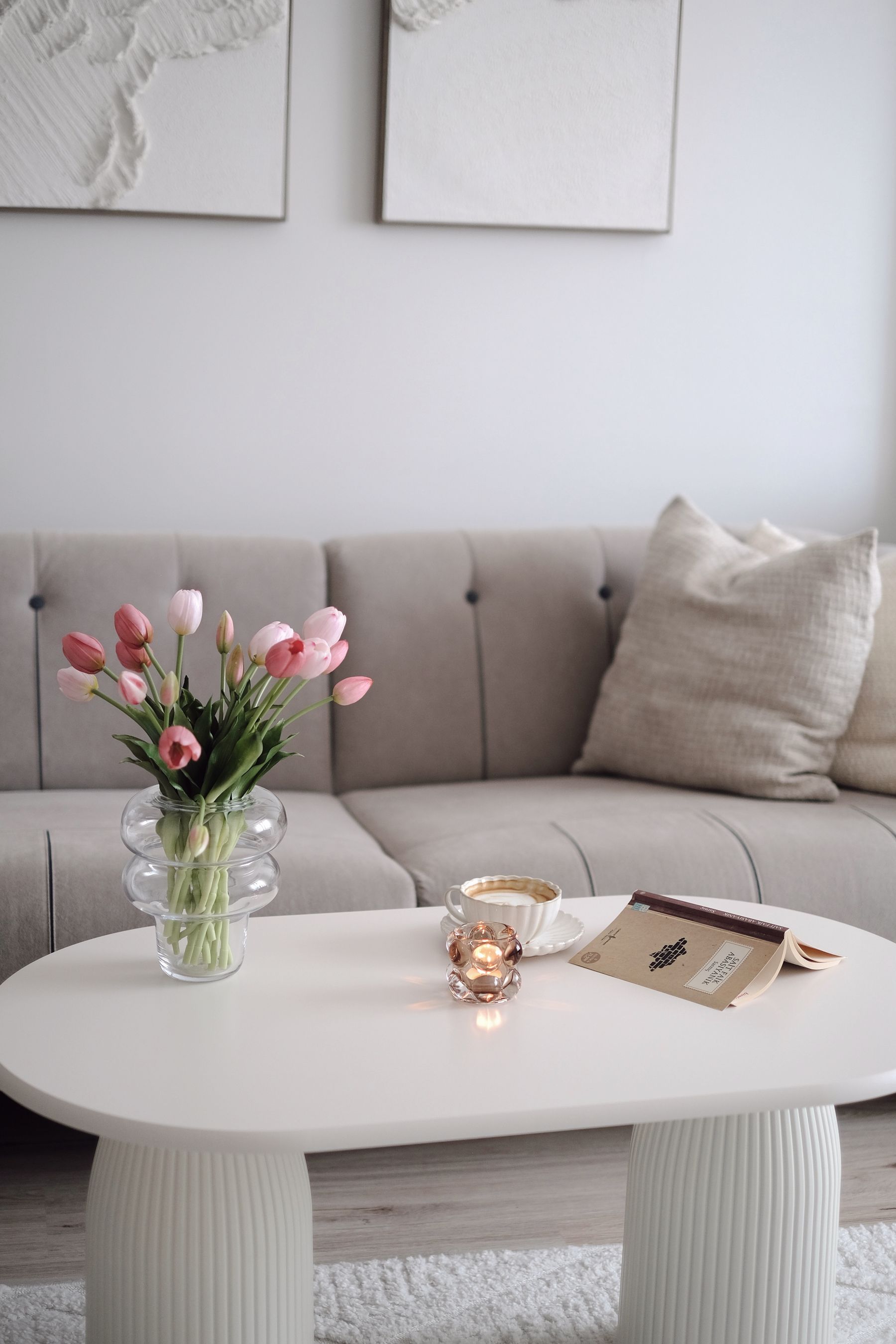 Tulips on a coffee table in a furnished living room
