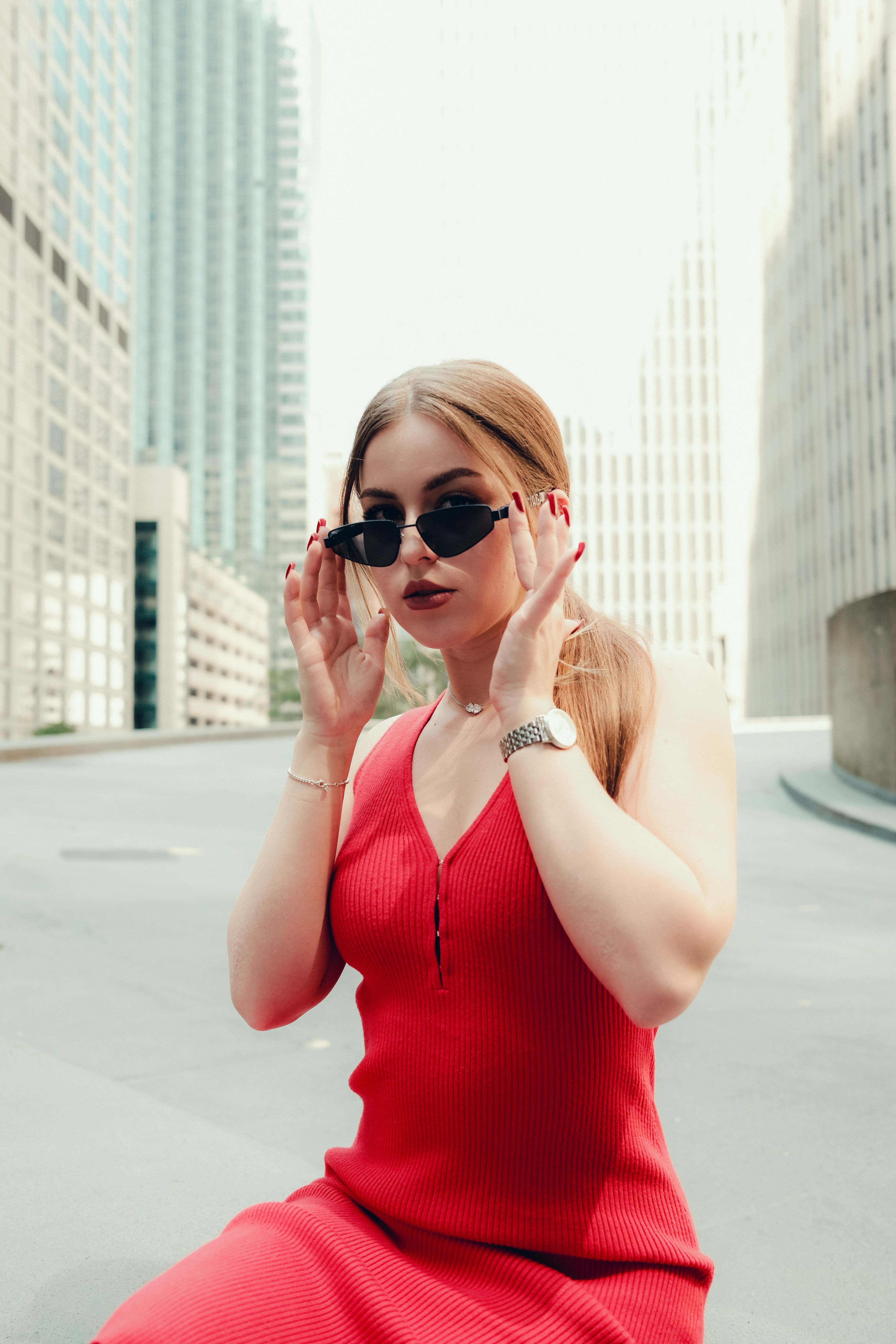 Stylish Woman in Red Dress with Urban Backdrop · Free Stock Photo