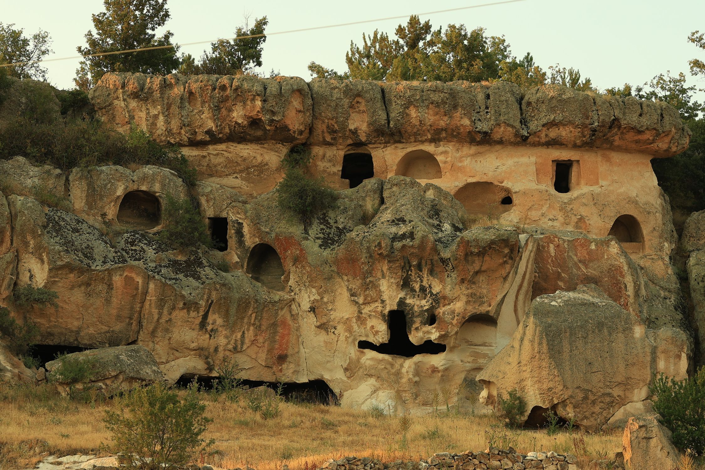 Ancient Rock Dwelling in Natural Cliff Formation · Free Stock Photo
