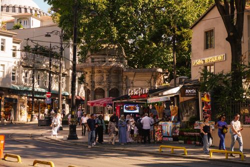 Free Vibrant street scene in Istanbul with people enjoying local food and shops Stock Photo