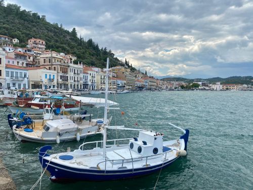 Free Explore the picturesque harbor of Gytheio, Greece with traditional boats and vibrant architecture. Stock Photo