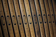 Elegant Row of Quranic Books with Arabic Calligraphy