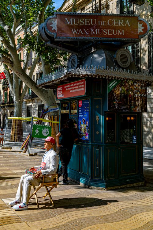 Free Sunny day at Museu de Cera in Barcelona with people and vibrant urban life. Stock Photo