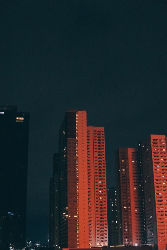 Red-lit towers at night by Nothing Ahead on Pexels