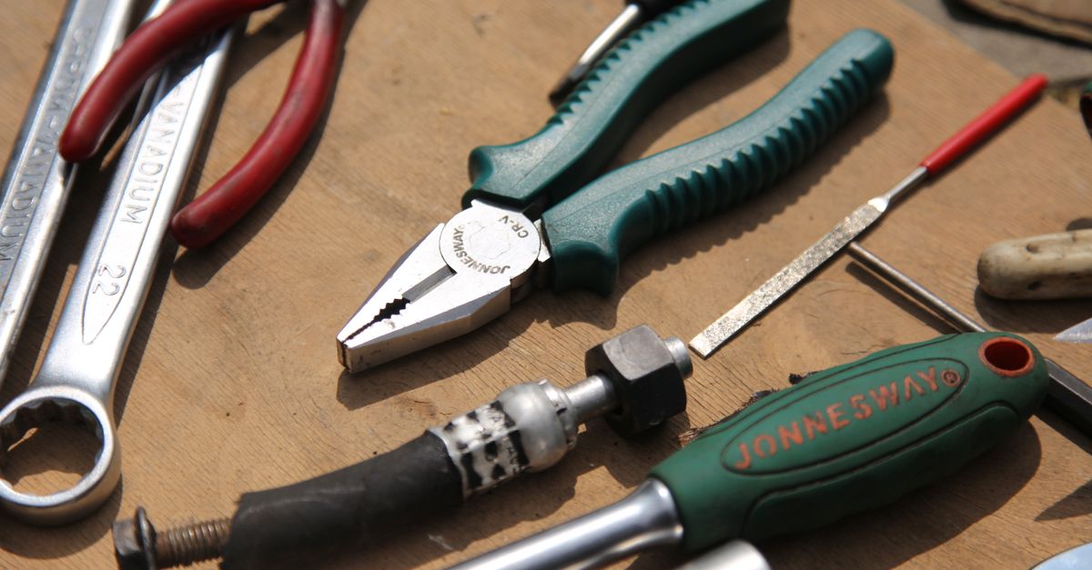 Basic Assorted Hand Tools Assorted Hand Tools on Wooden Surface · Free Stock Photo