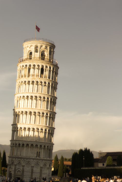 Free Iconic Leaning Tower of Pisa captured during golden hour, showcasing its unique tilt against a serene sky. Stock Photo
