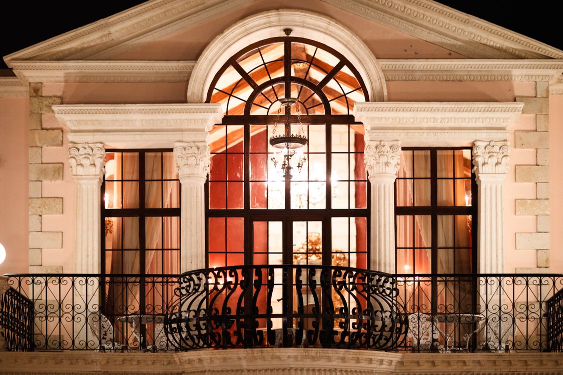 Elegant Nighttime View of Neoclassical Balcony · Free Stock Photo
