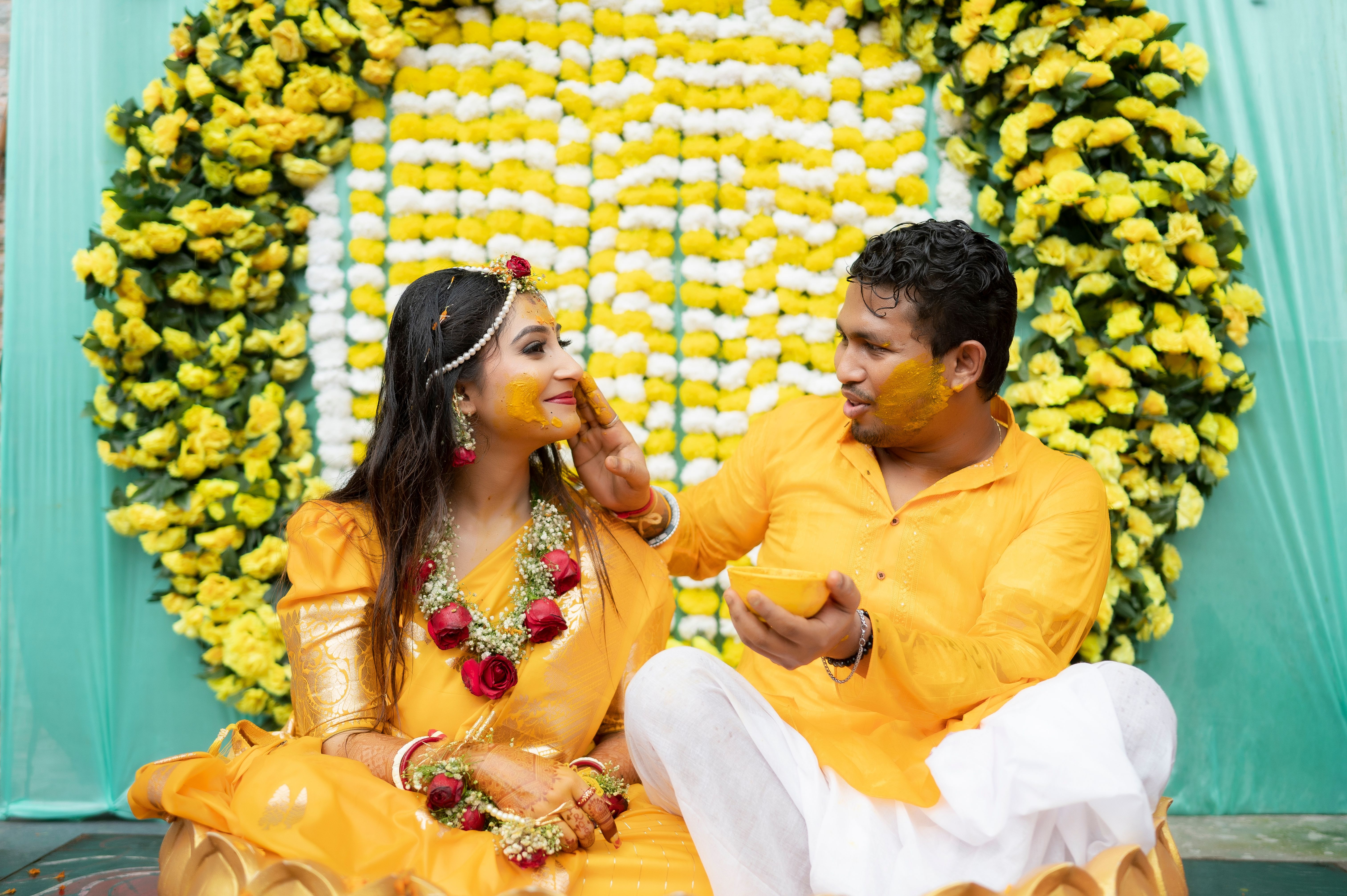 Marigold garlands and a lit banquet lawn at a Delhi wedding venue at night