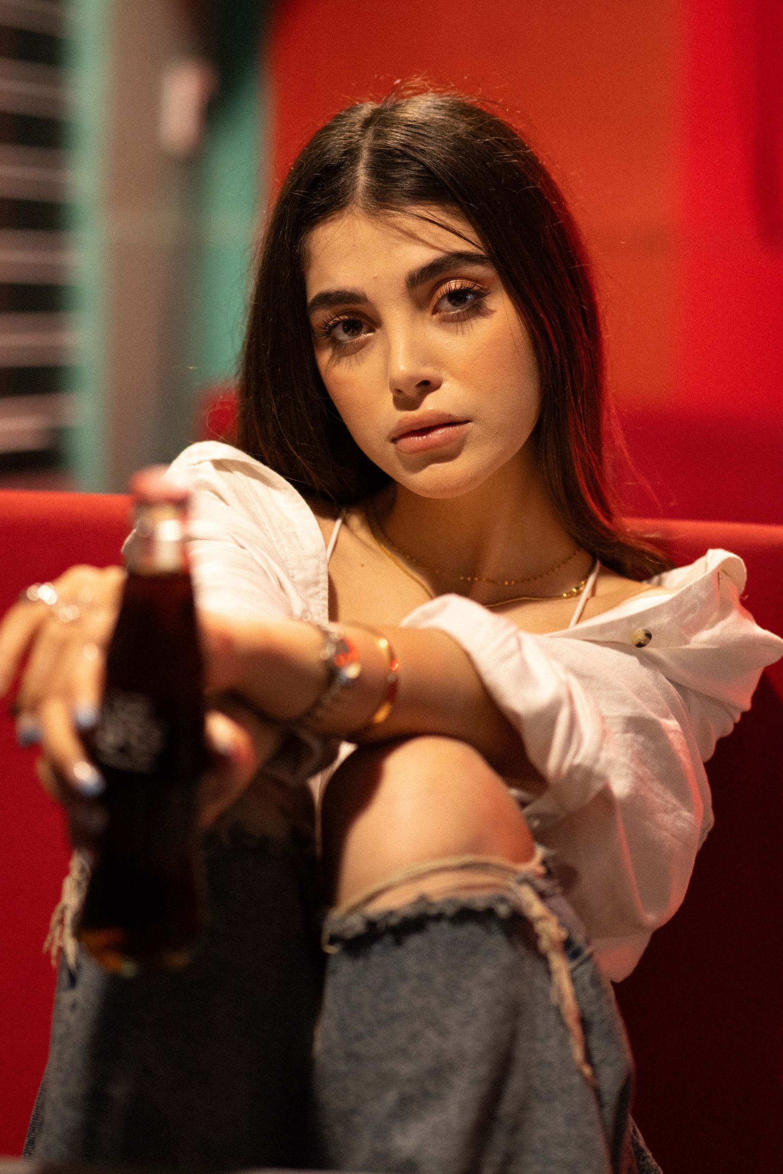 A Woman in a Red Polka Dot Dress Holding a Coke Can · Free Stock Photo