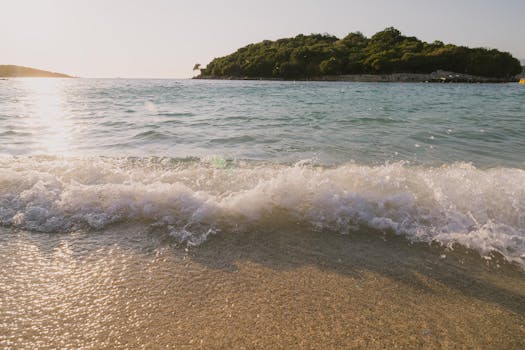 Peaceful beach scene at sunset in Ksamil, Albania. Ideal for relaxation and travel inspiration.