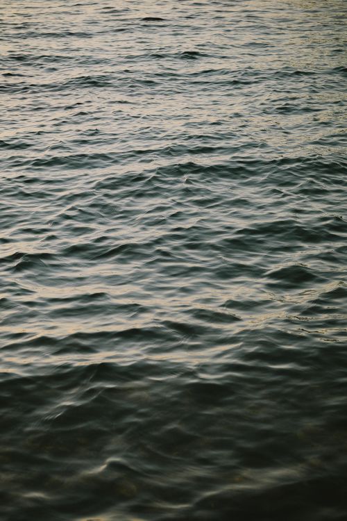 Free Serene image of gentle waves during golden hour at Ksamil Beach, Albania. Stock Photo