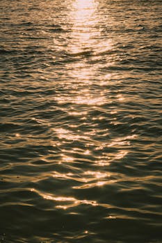 Golden sunset over the tranquil waters of Ksamil, Albania, capturing the peaceful essence of summer.