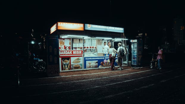 Street food stall serving corn and ice cream at night in Turkey.