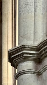 Close-up view of a Gothic stone column showcasing intricate architectural details in a cathedral setting.