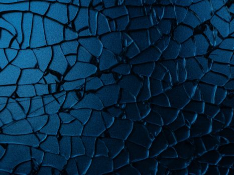Close-up view of a cracked blue surface with abstract patterns and textures.