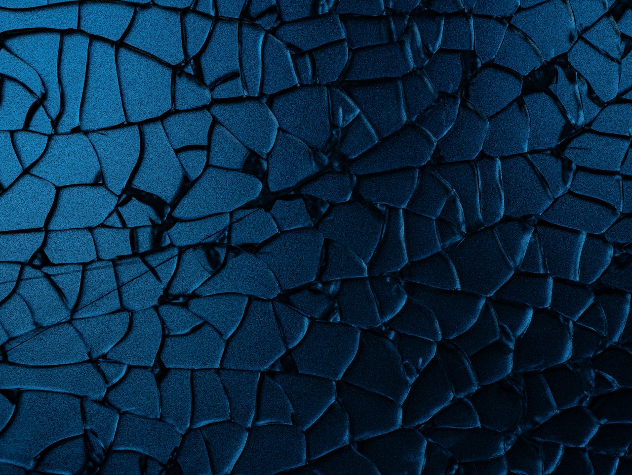 close up view of a cracked blue surface with abstract patterns and tex