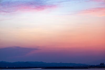 Pastel dawn light over a hillside — photo by Regan Dsouza on Pexels
