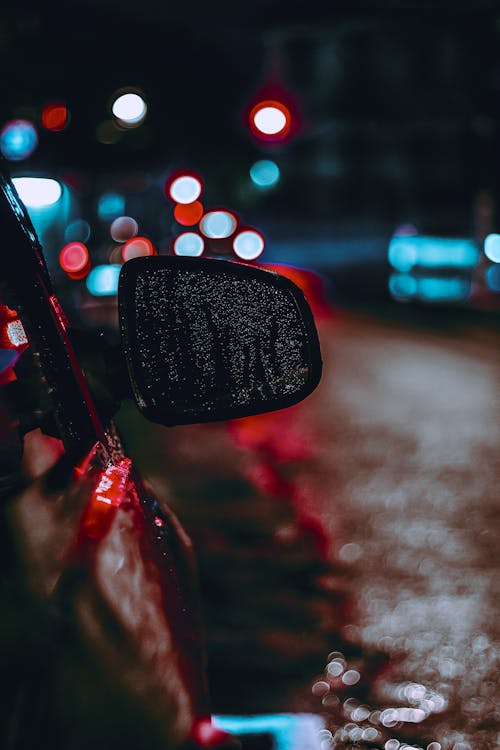 Selective Focus Photography of Side Mirror During Night