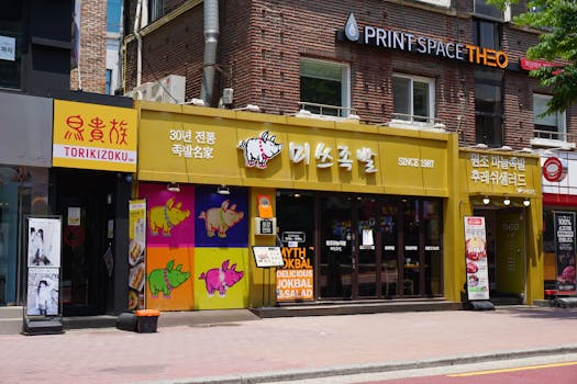 Vibrant facade of a Korean restaurant with traditional and modern elements.