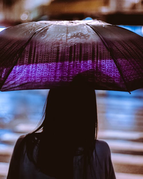 Woman Holding Purple Umbrella