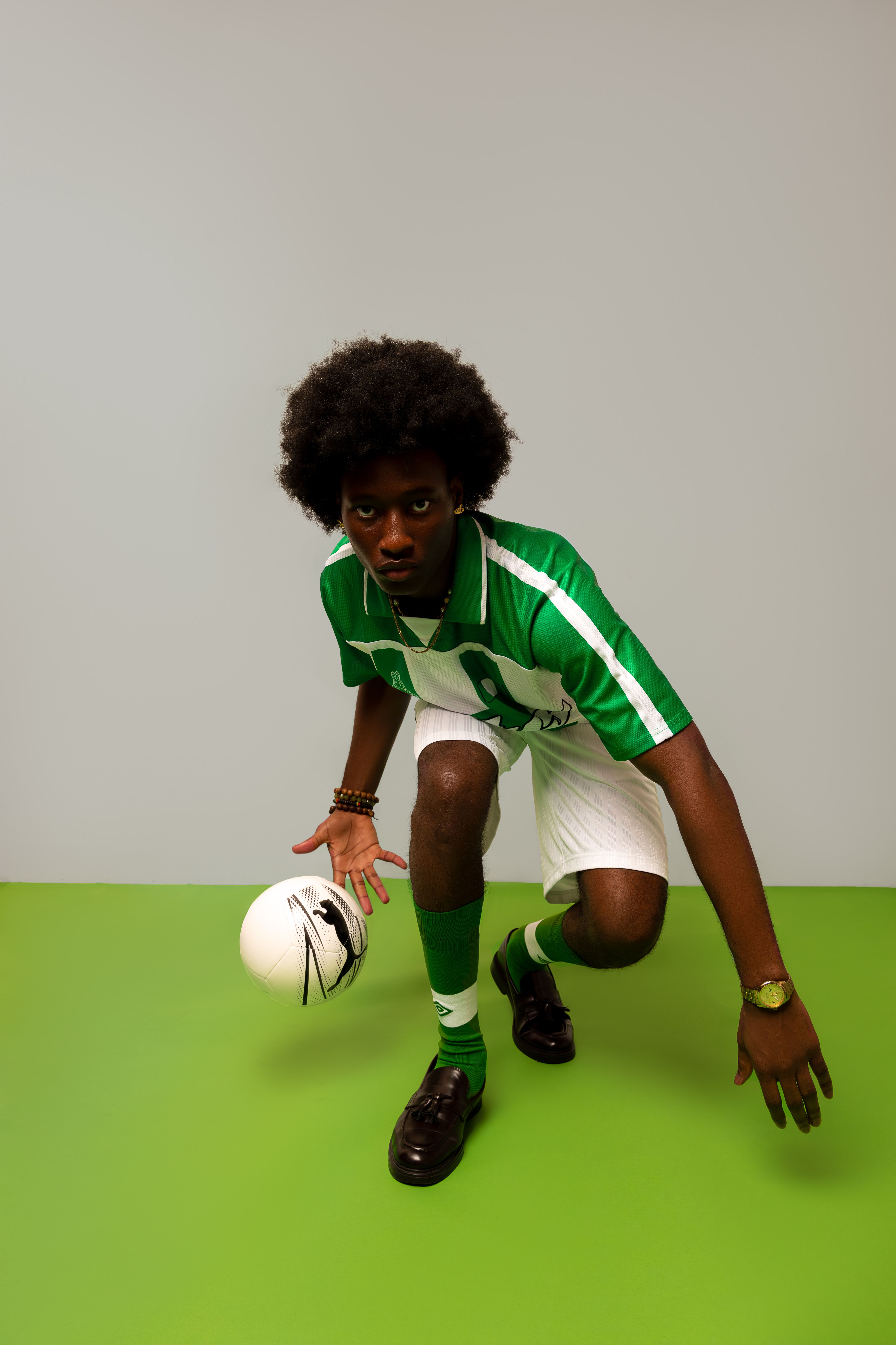 Dynamic Portrait of Soccer Player in Green Jersey · Free Stock Photo