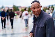Elderly Man in Traditional Clothing Outdoors