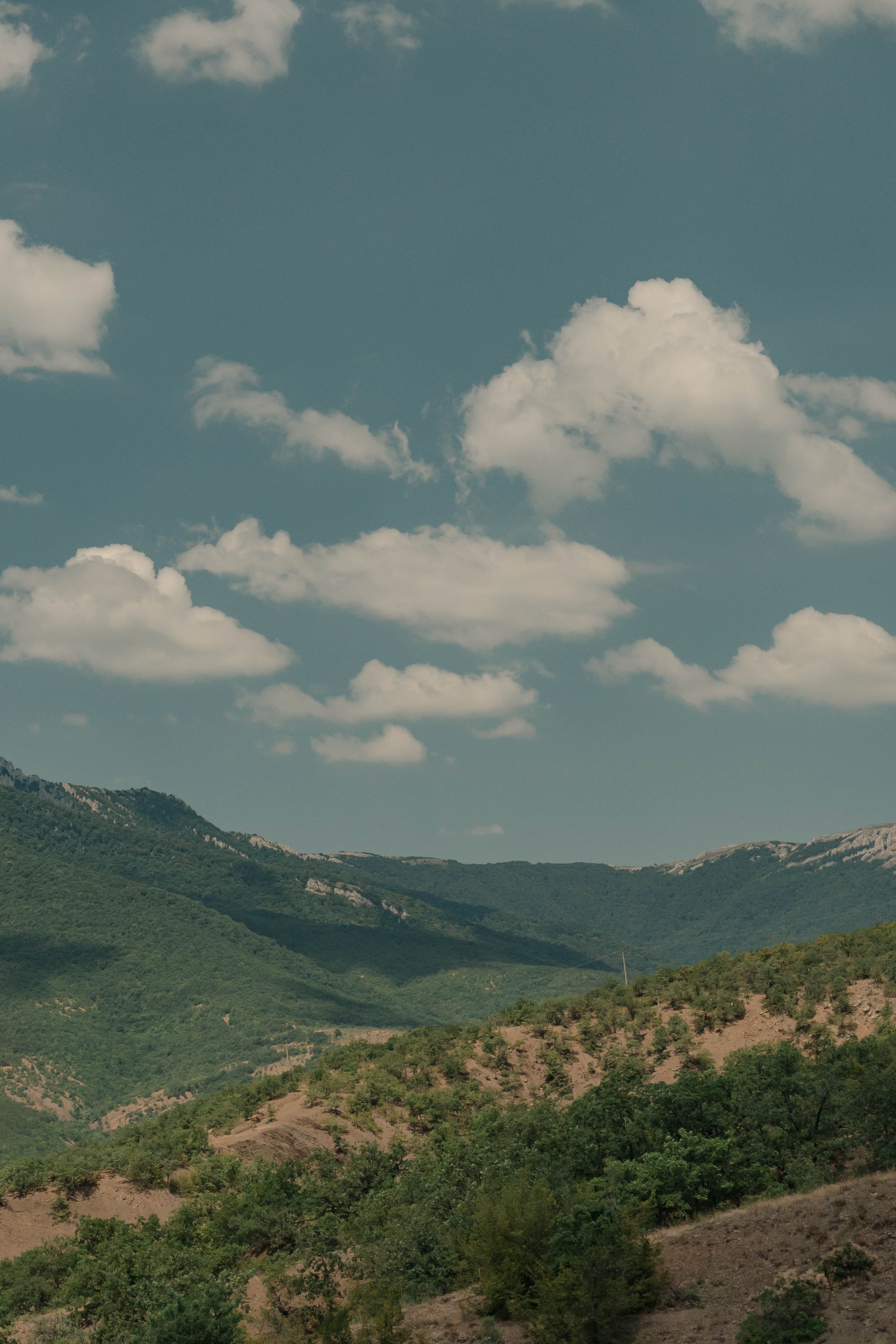 Serene Mountain Landscape Under Blue Sky · Free Stock Photo