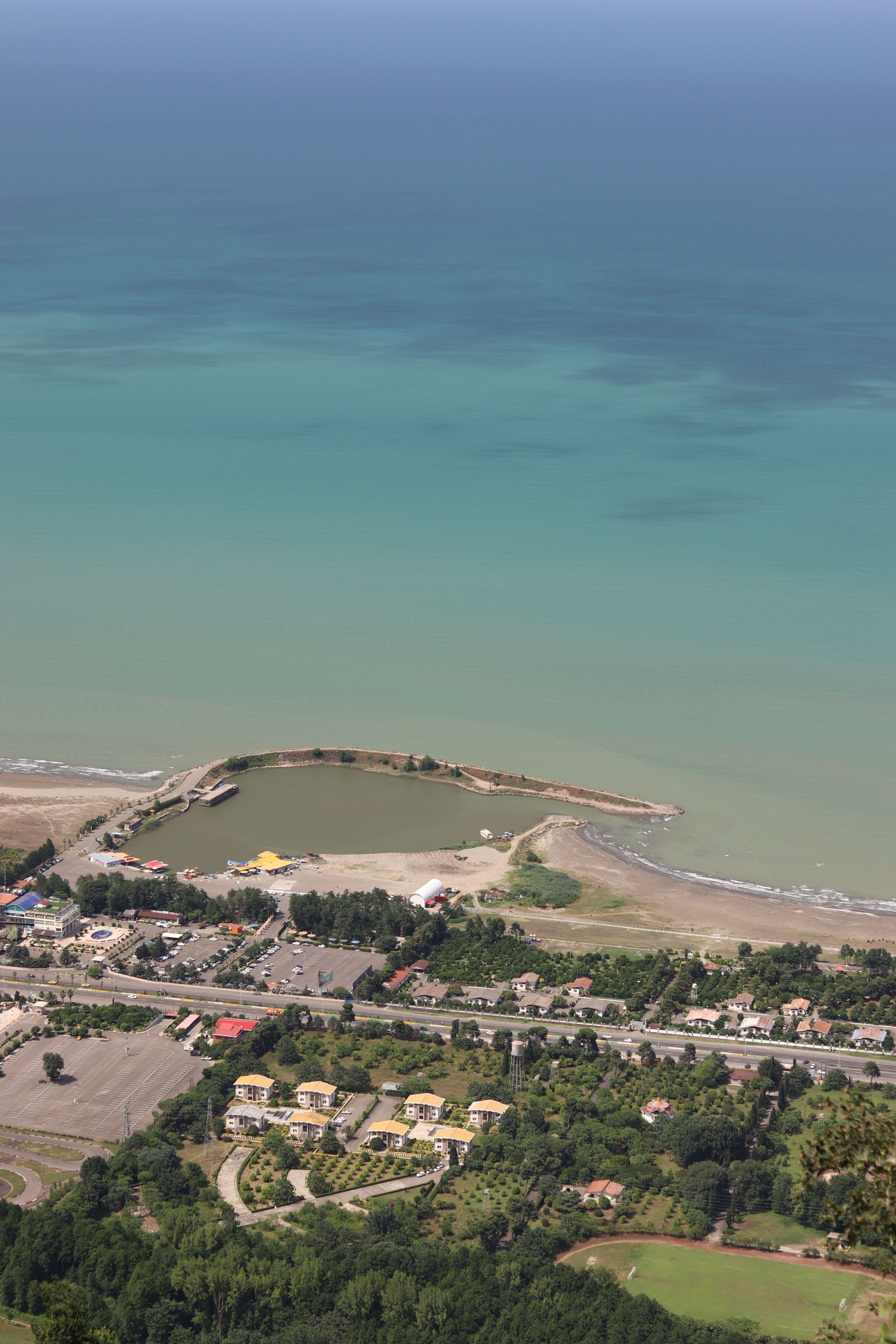 Aerial view of coastal town and turquoise sea · Free Stock Photo