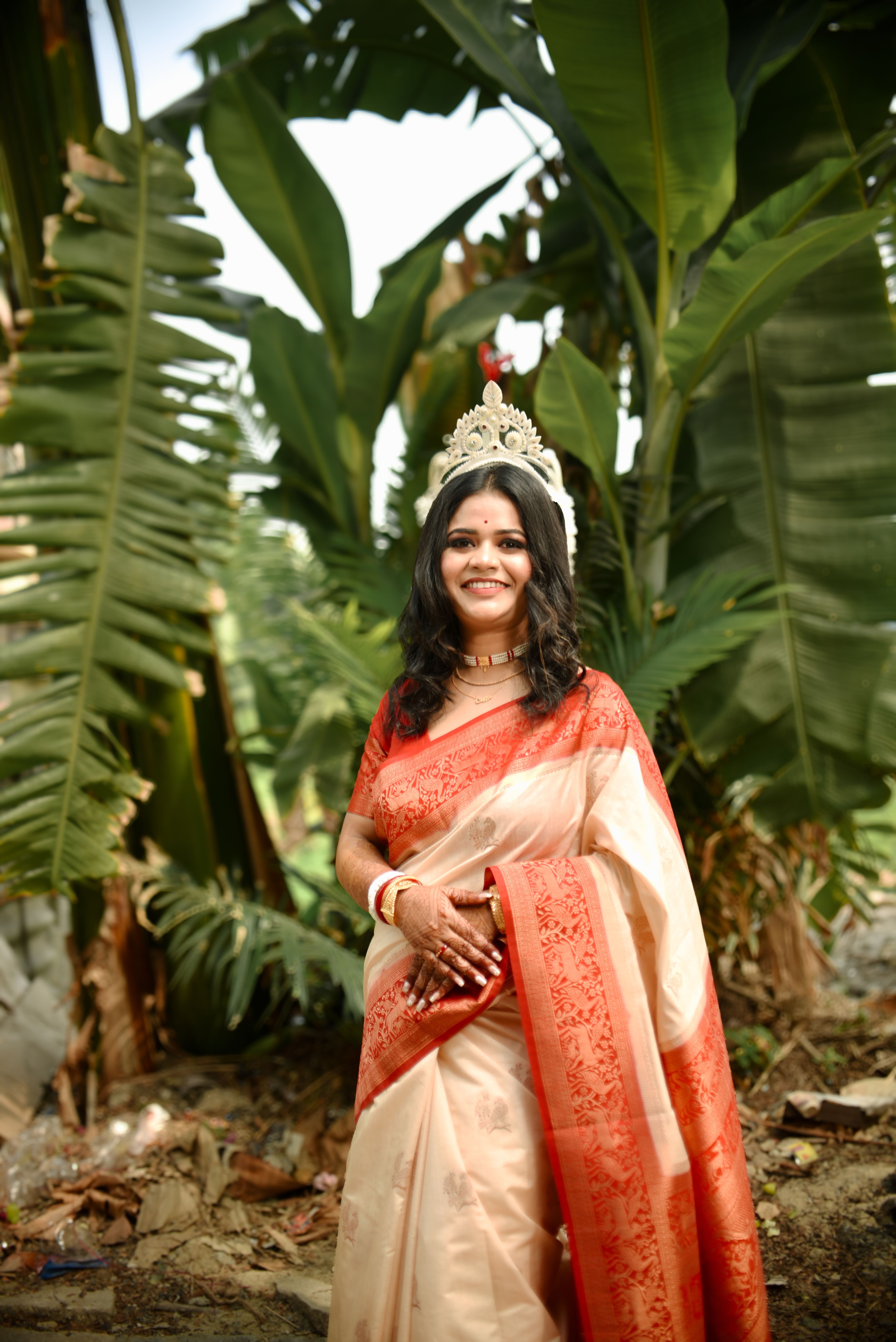 Elegant Woman in Red Saree Walking Outdoors · Free Stock Photo