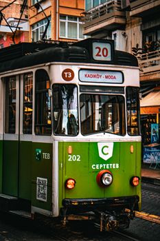 Vintage green tram on the Kadıköy-Moda line in Istanbul, Türkiye, capturing a classic urban scene.