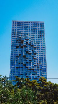 A striking modern skyscraper in Tiran, Albania, with unique architectural design.