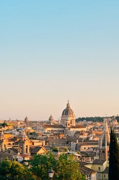 Captivating view of Rome's skyline at sunset, showcasing historic architecture and warm hues.