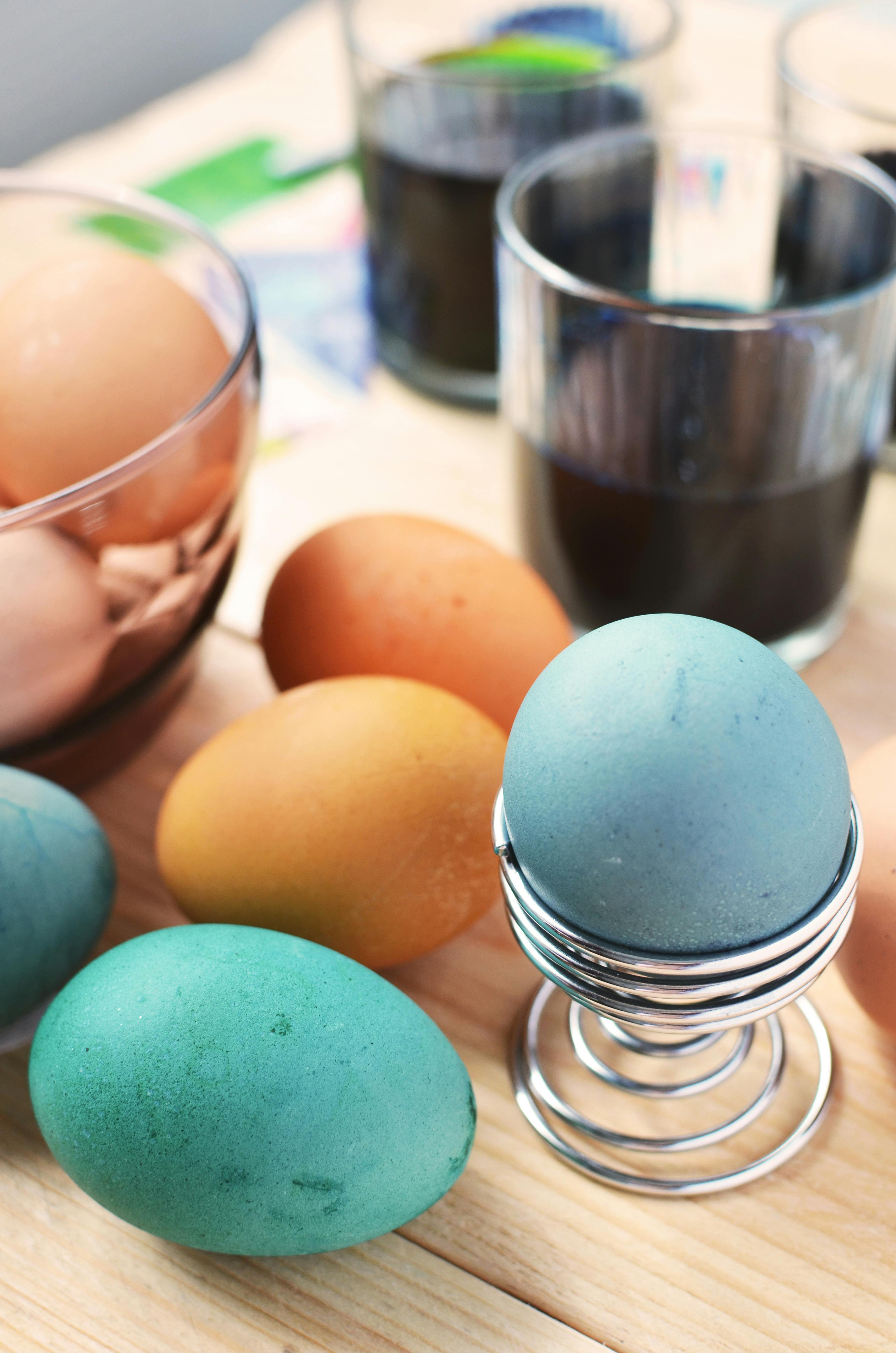 Brown and Blue Eggs Beside Drinking Glass · Free Stock Photo