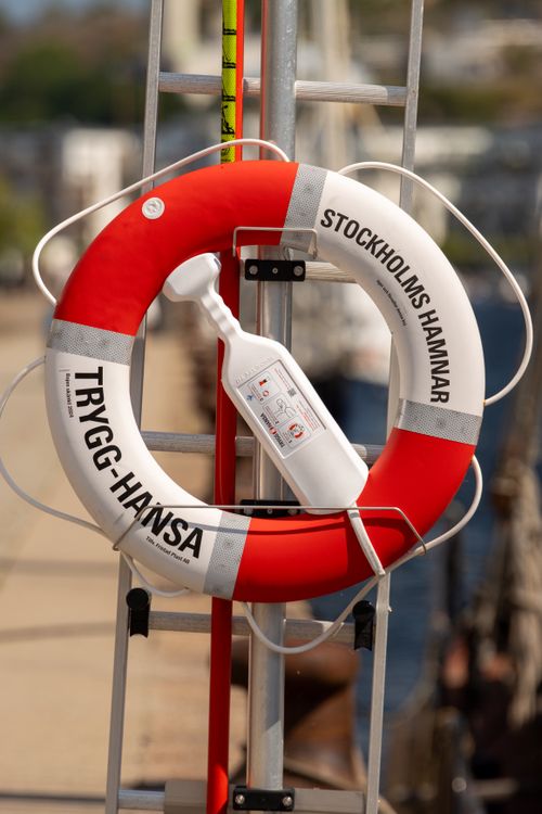 Free Close-up of a lifesaver ring labeled 'Stockholms Hamnar' on a dock in Stockholm. Stock Photo